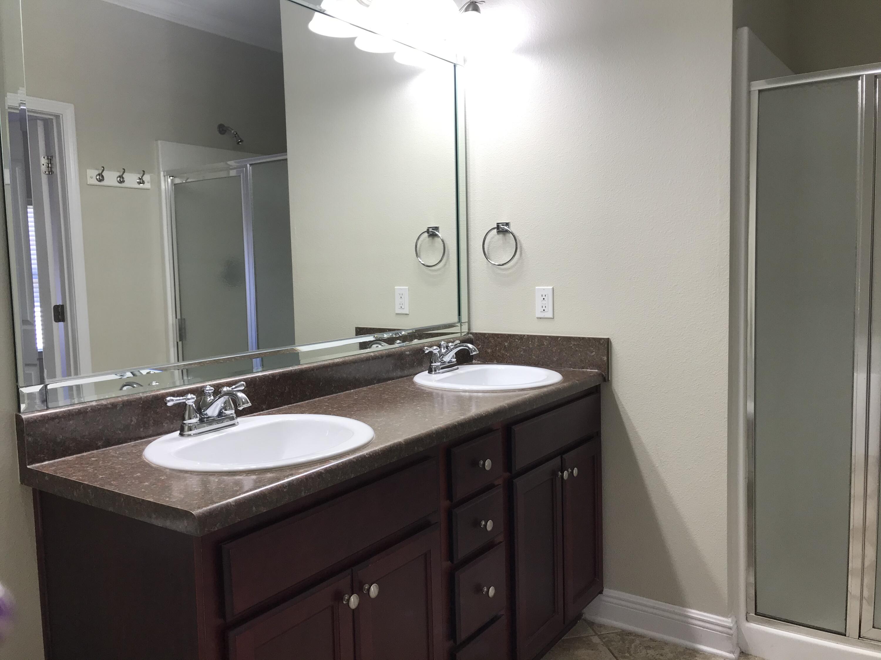 749 Lime Lane Crestview, FL 32536 - Photo 10 of 14 a bathroom with a sink and a mirror