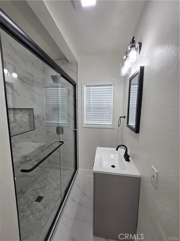 a bathroom with a toilet a sink and bathtub