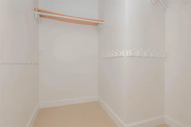 a bathroom with a granite countertop sink a toilet and a shower