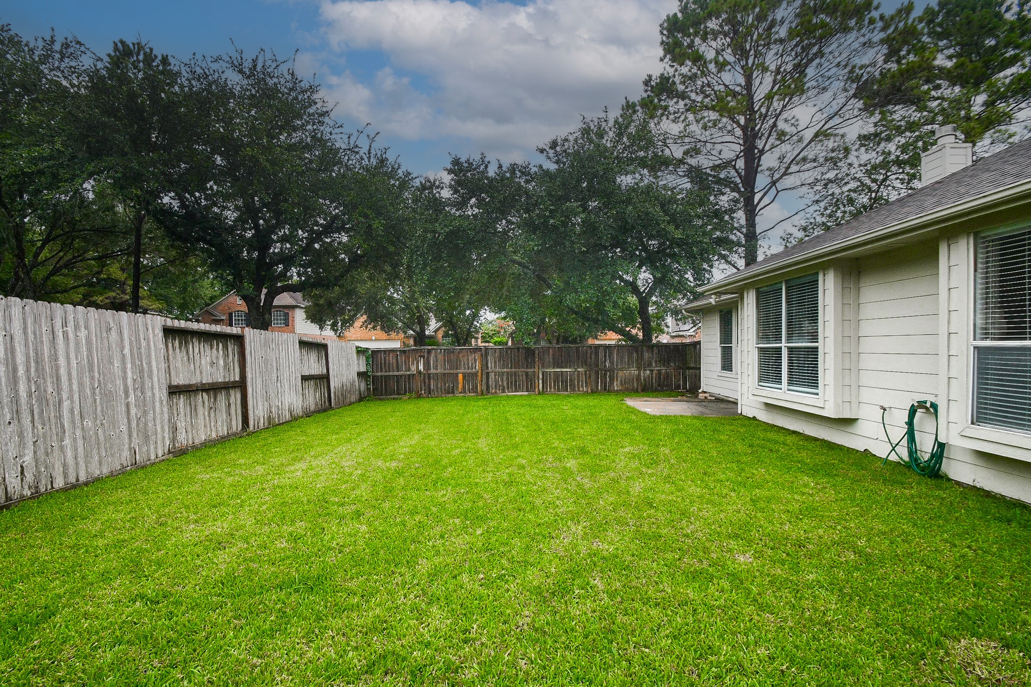 5602 Walkabout Way Katy, TX 77450 - Photo 31 of 33 a view of a backyard with a garden and tree