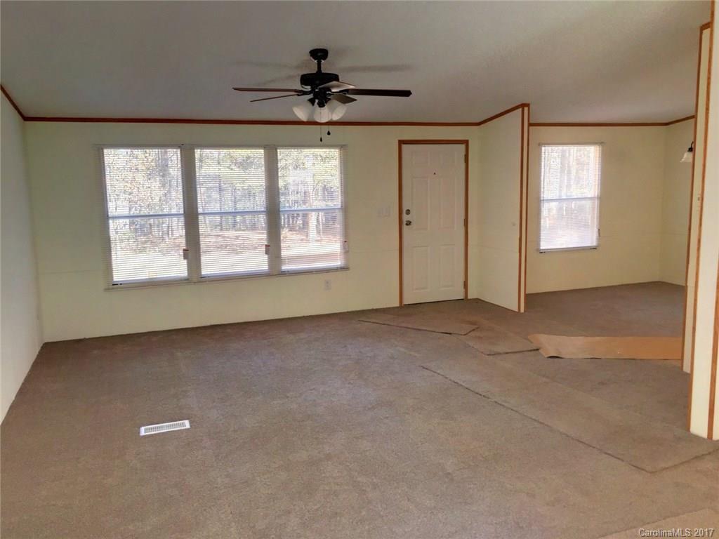 145 Loray Farm Road, Unit L2 Dallas, NC 28034 - Photo 4 of 9 a view of an empty room with a window