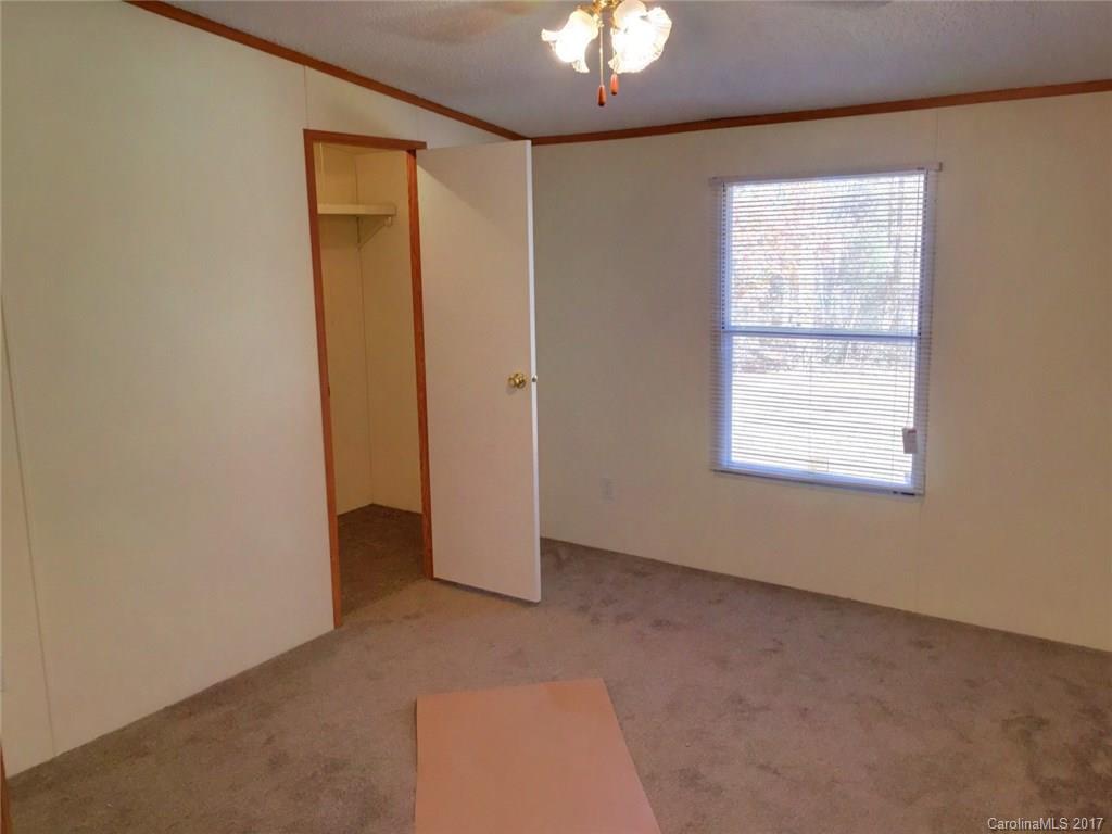 145 Loray Farm Road, Unit L2 Dallas, NC 28034 - Photo 5 of 9 an empty room with a window