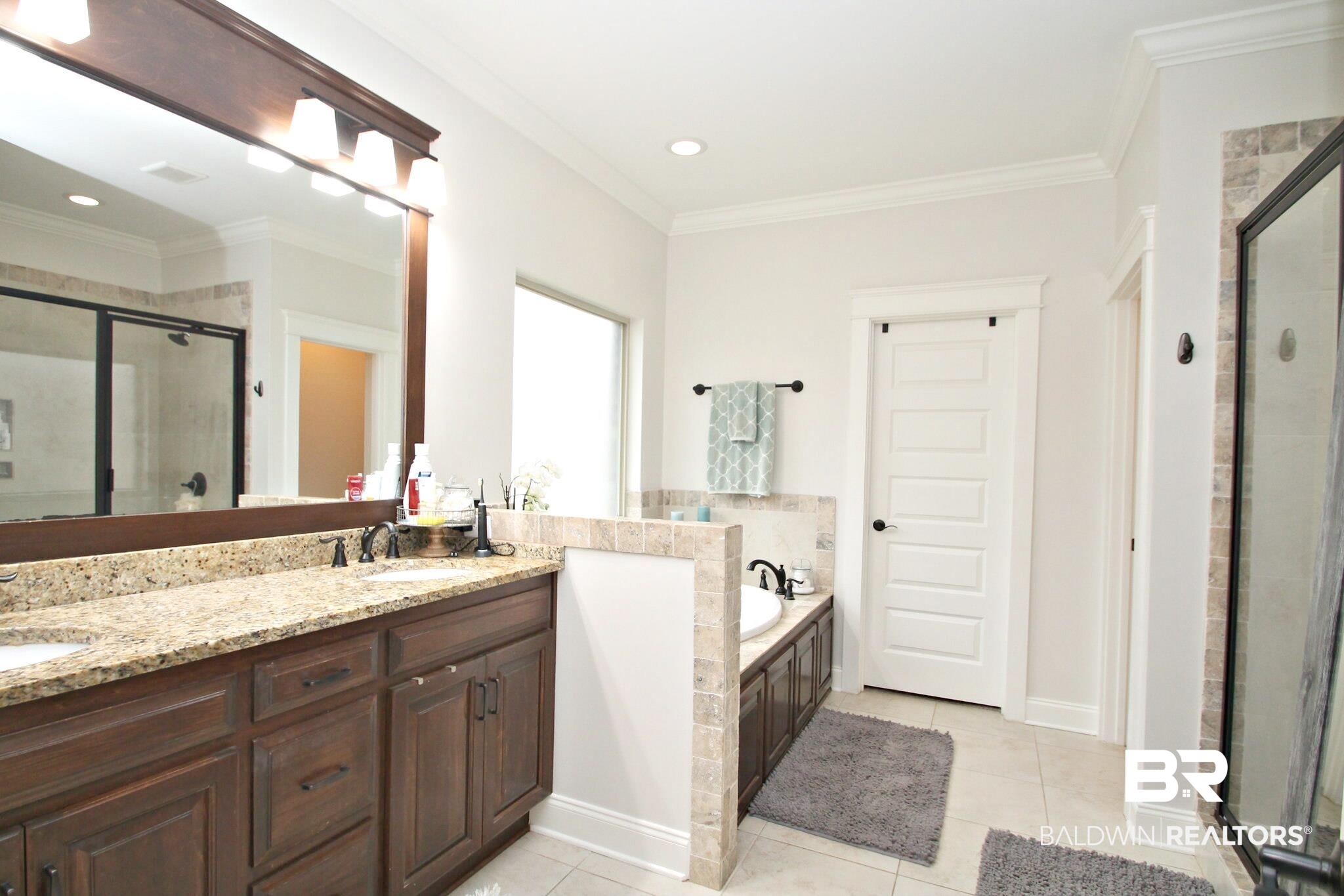 30232 Persimmon Drive Daphne, AL 36527 - Photo 13 of 27 Bathroom featuring tile patterned flooring, a sink, and a bath