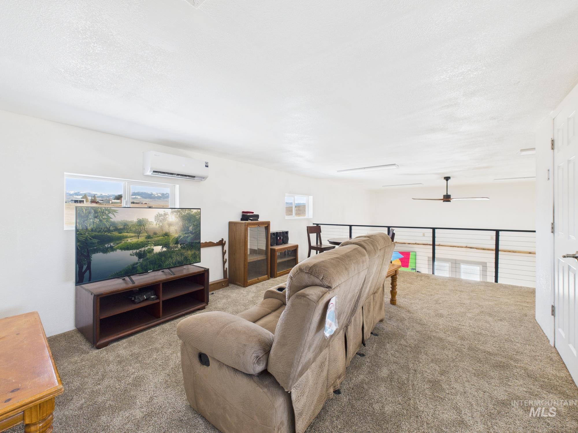 1086 Highland Lane Mesa, ID 83643 - Photo 19 of 45 Living room featuring carpet floors and a ceiling fan