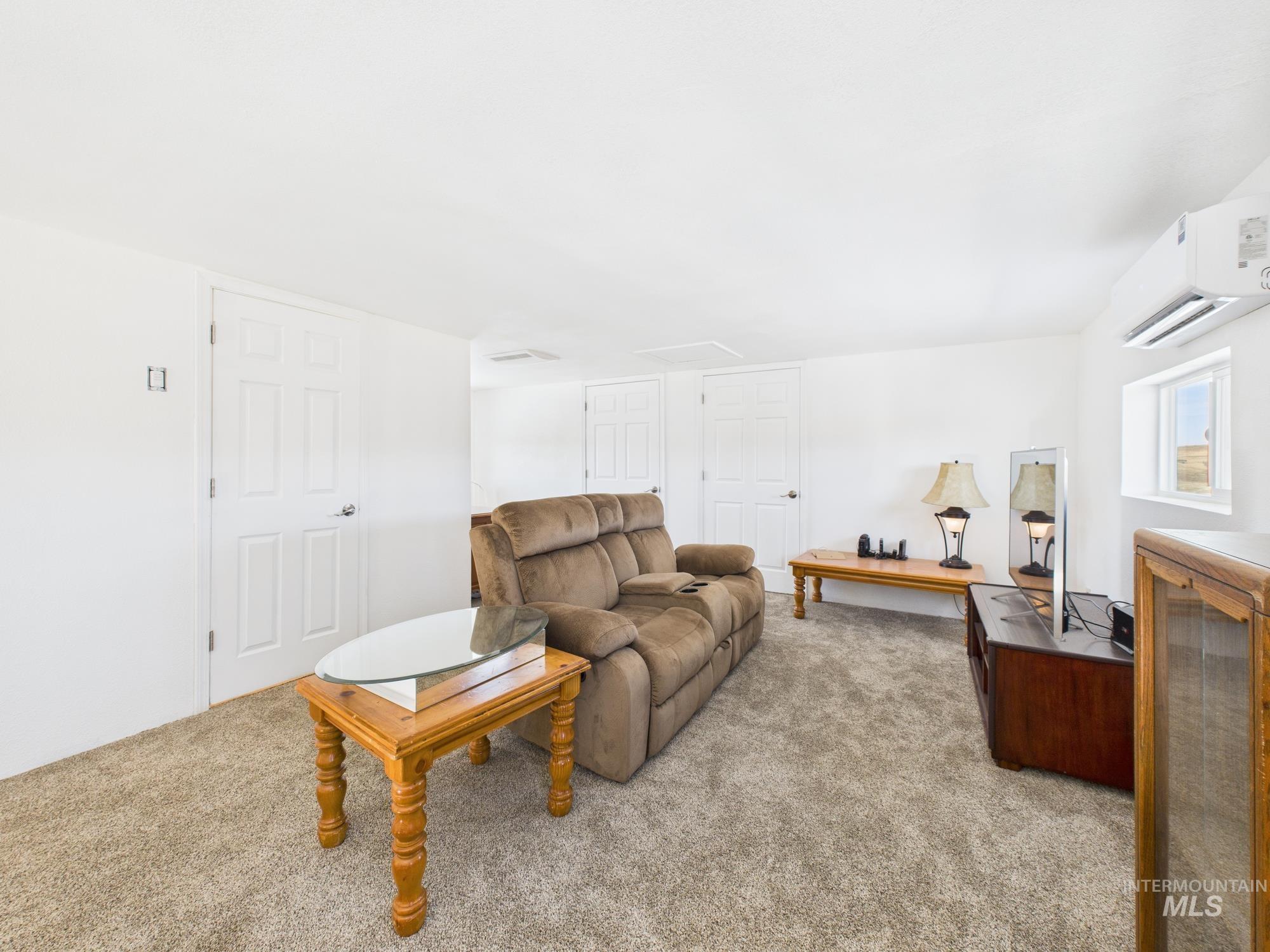 1086 Highland Lane Mesa, ID 83643 - Photo 21 of 45 Carpeted living area featuring a mini split for heating / cooling
