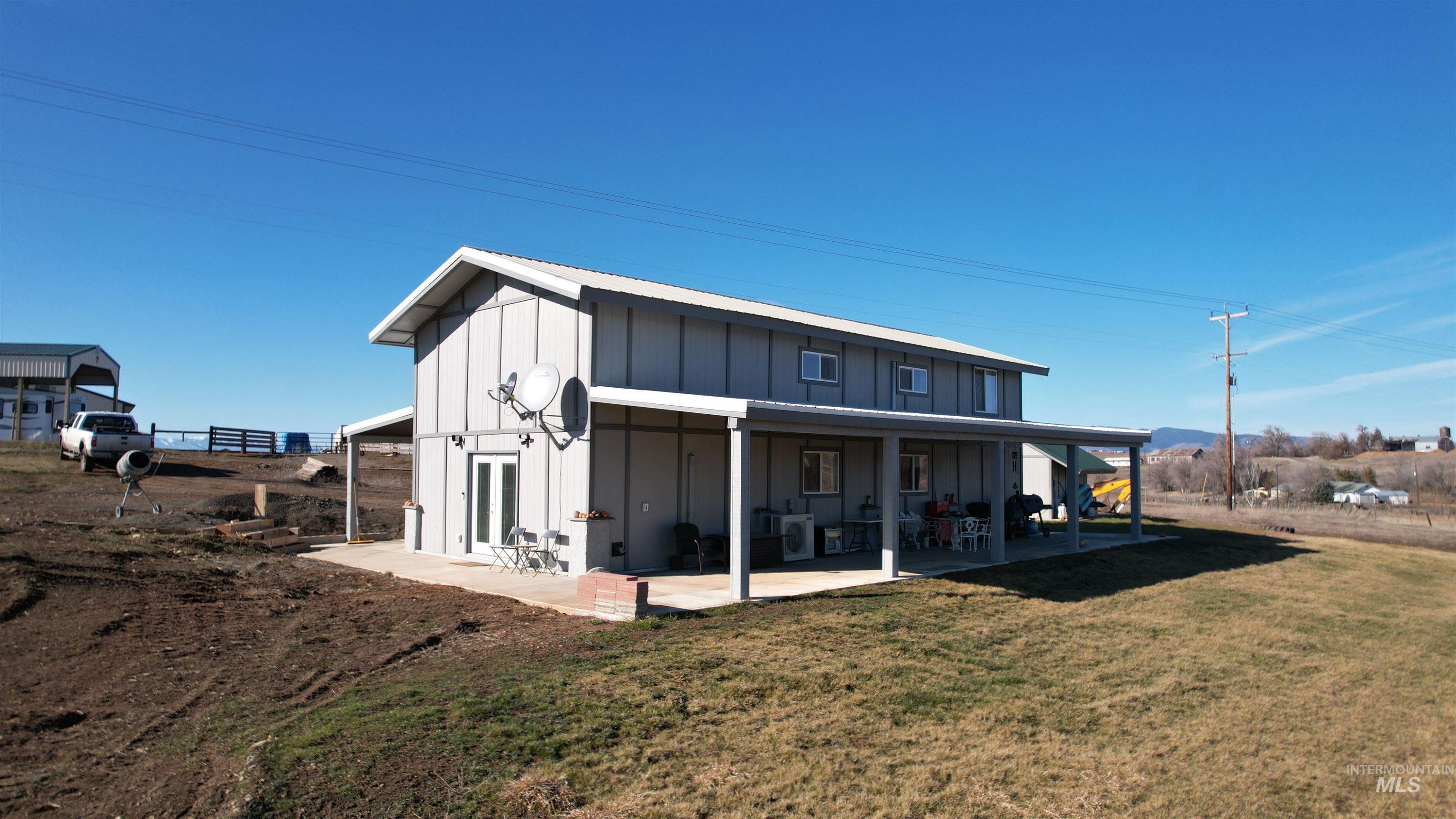 1086 Highland Lane Mesa, ID 83643 - Photo 5 of 45 Back of house featuring board and batten siding
