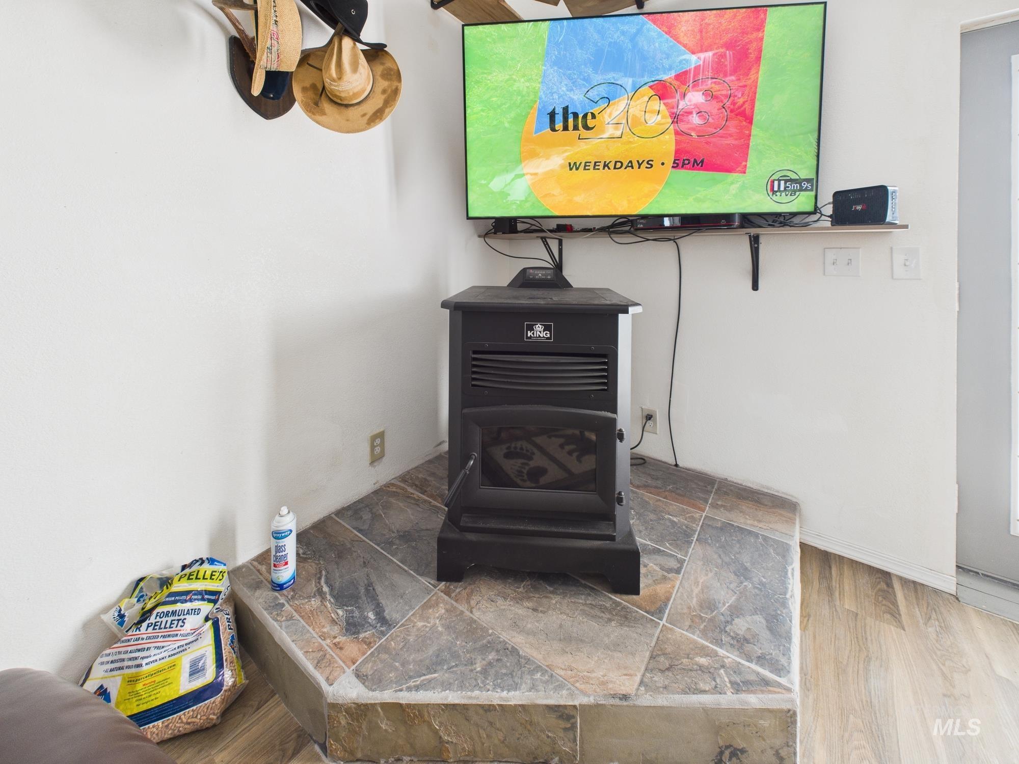 1086 Highland Lane Mesa, ID 83643 - Photo 10 of 45 Detailed view of a wood stove and wood finished floors