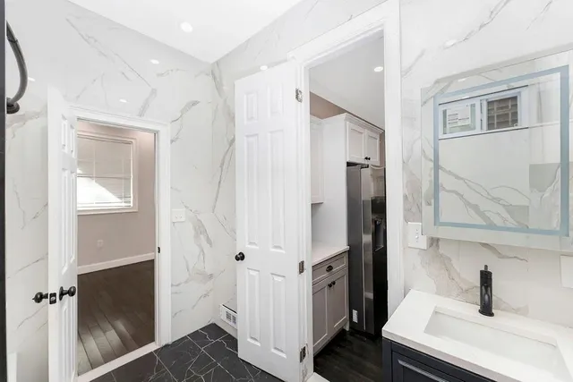 a bathroom with a sink and mirror