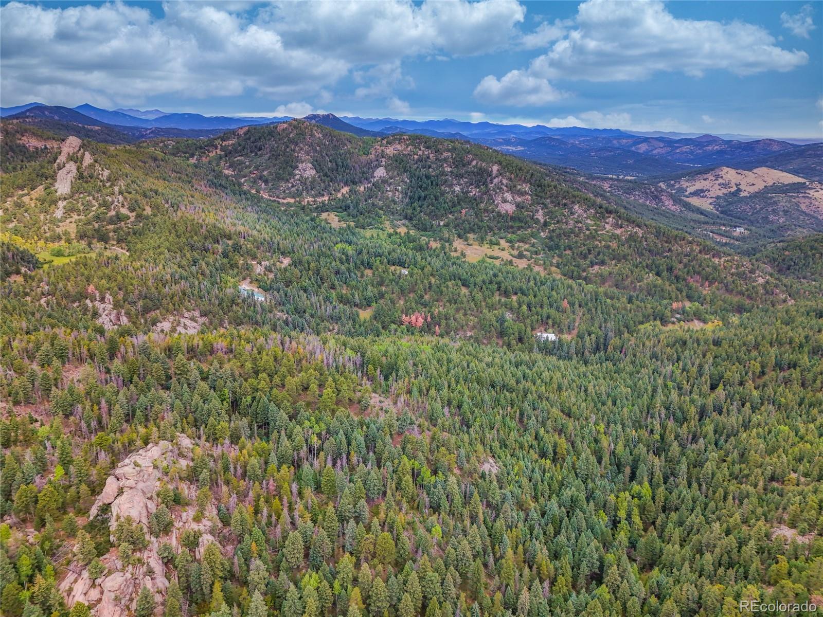 0 Indian Springs Road Morrison, CO 80465 - Photo 12 of 28 a view of a mountain range with lush green forest