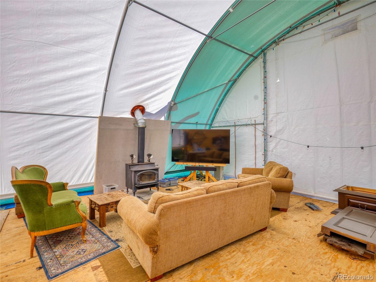 0 Indian Springs Road Morrison, CO 80465 - Photo 5 of 28 a living room with furniture and a flat screen tv