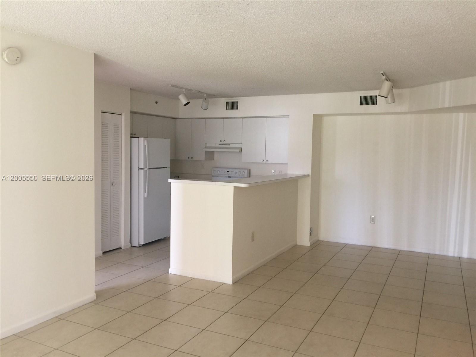 2103 Renaissance Boulevard, Unit 104 Miramar, FL 33025 - Photo 1 of 12 a view of a storage & utility room with a sink