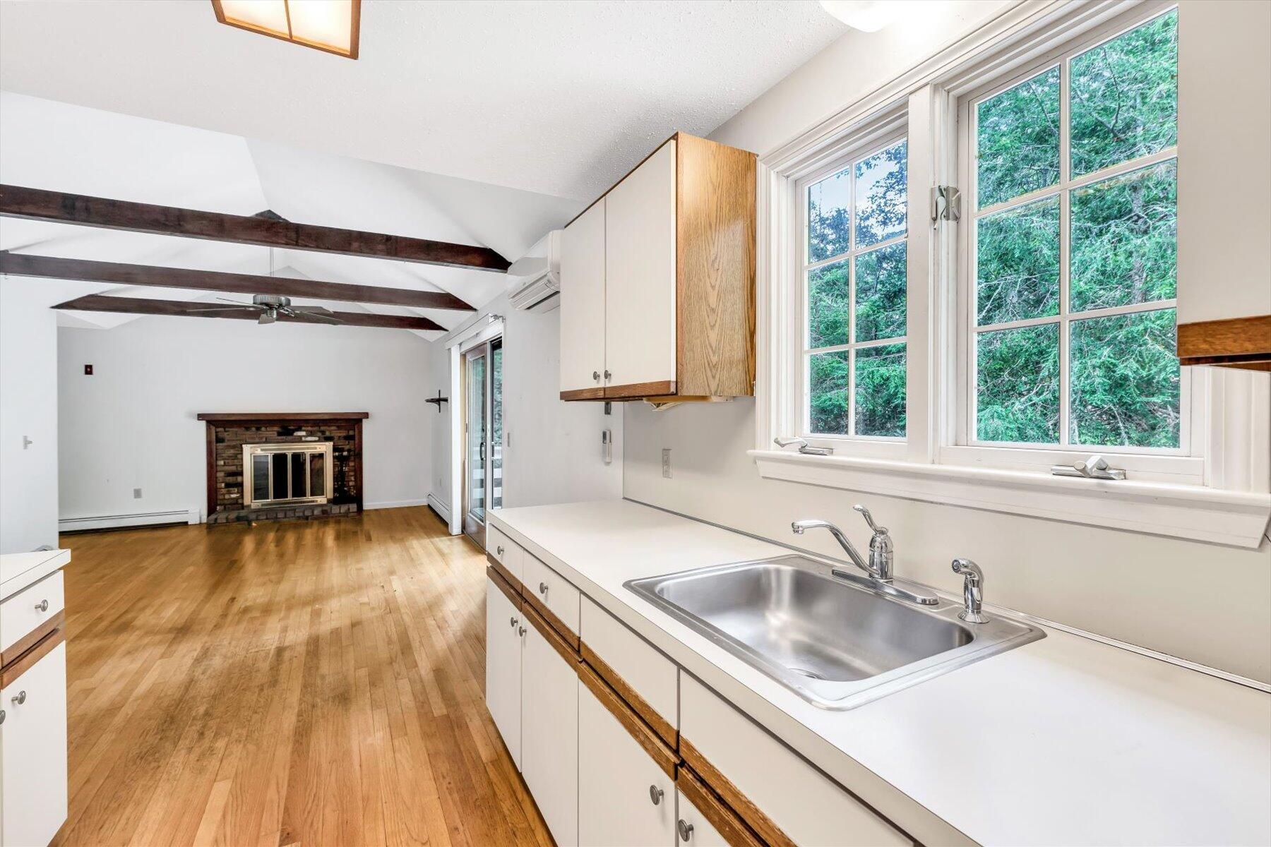 97 Headwaters Road Centerville, MA 02632 - Photo 11 of 44 a kitchen with a sink and a large window