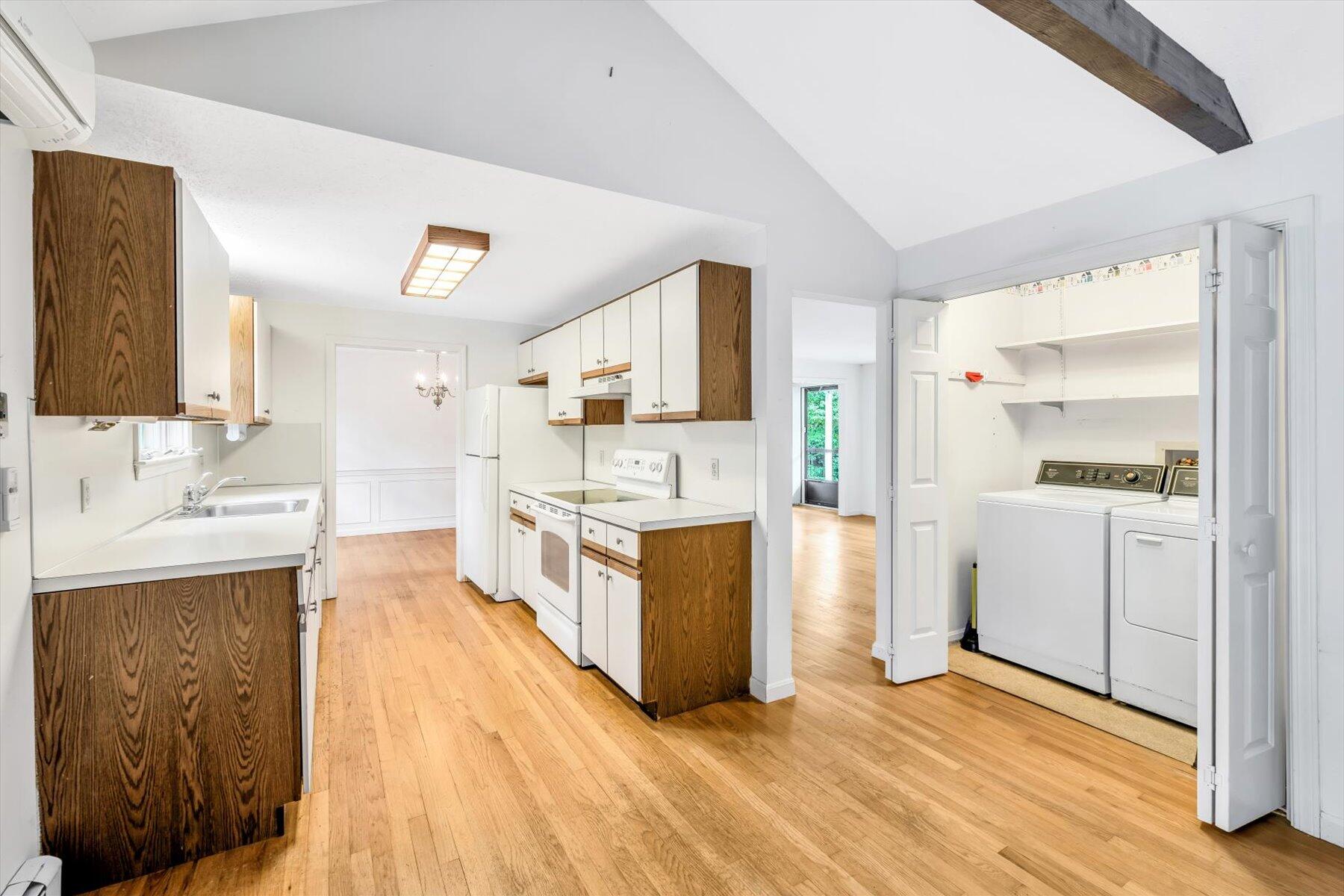 97 Headwaters Road Centerville, MA 02632 - Photo 12 of 44 a large kitchen with a lot of counter space and wooden floor