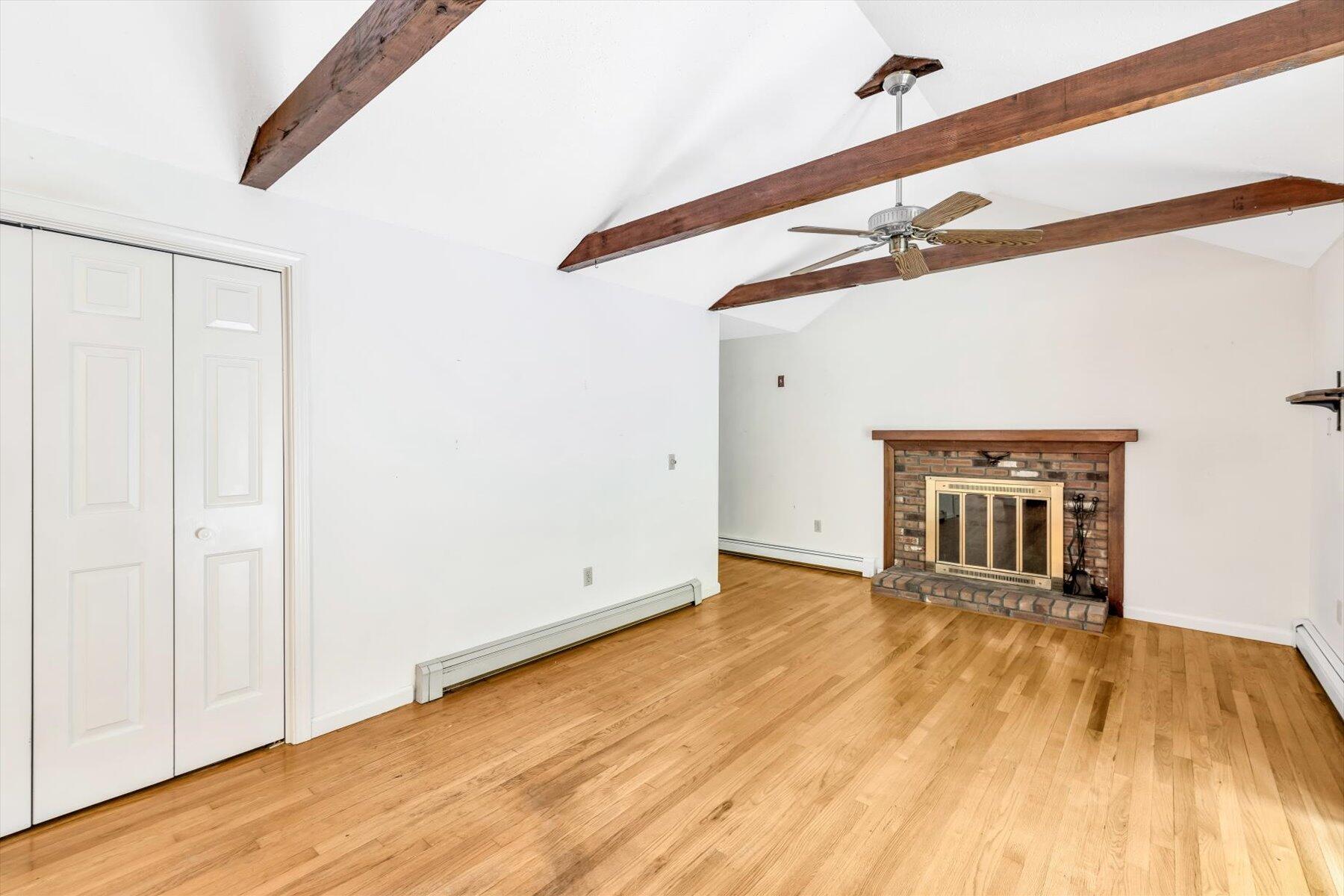 97 Headwaters Road Centerville, MA 02632 - Photo 15 of 44 a view of an empty room with wooden floor