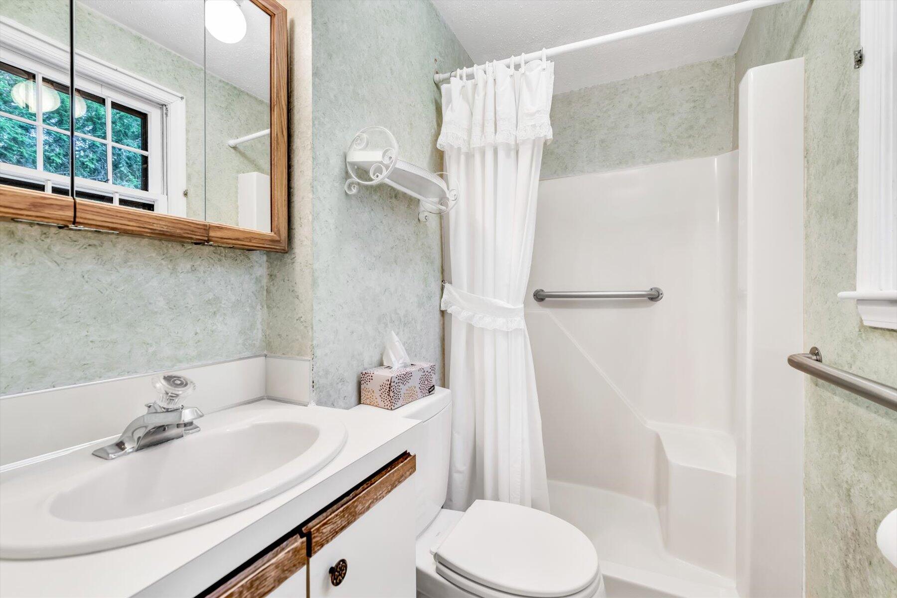 97 Headwaters Road Centerville, MA 02632 - Photo 23 of 44 a bathroom with a sink toilet and shower