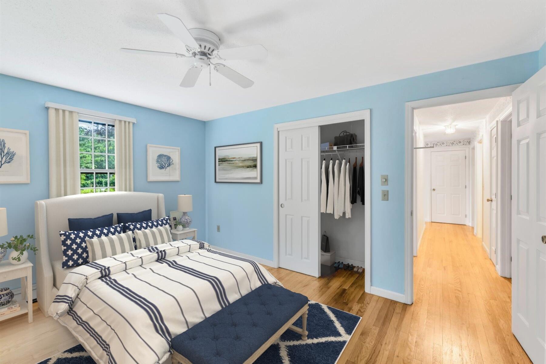 97 Headwaters Road Centerville, MA 02632 - Photo 25 of 44 a bedroom with a bed and a chandelier