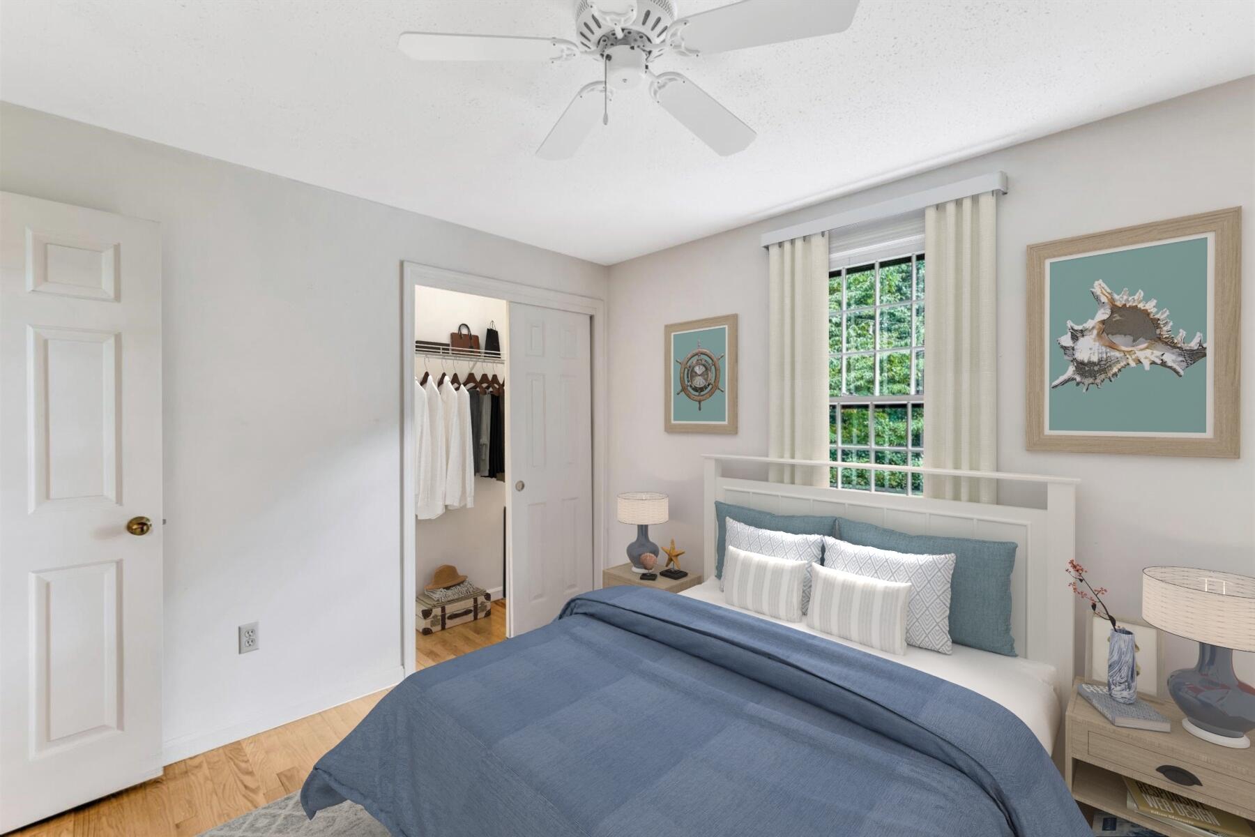 97 Headwaters Road Centerville, MA 02632 - Photo 28 of 44 a bedroom with a bed and a chandelier