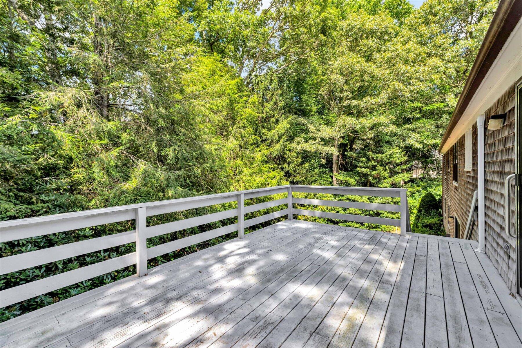 97 Headwaters Road Centerville, MA 02632 - Photo 37 of 44 a view of backyard with deck and wooden floor