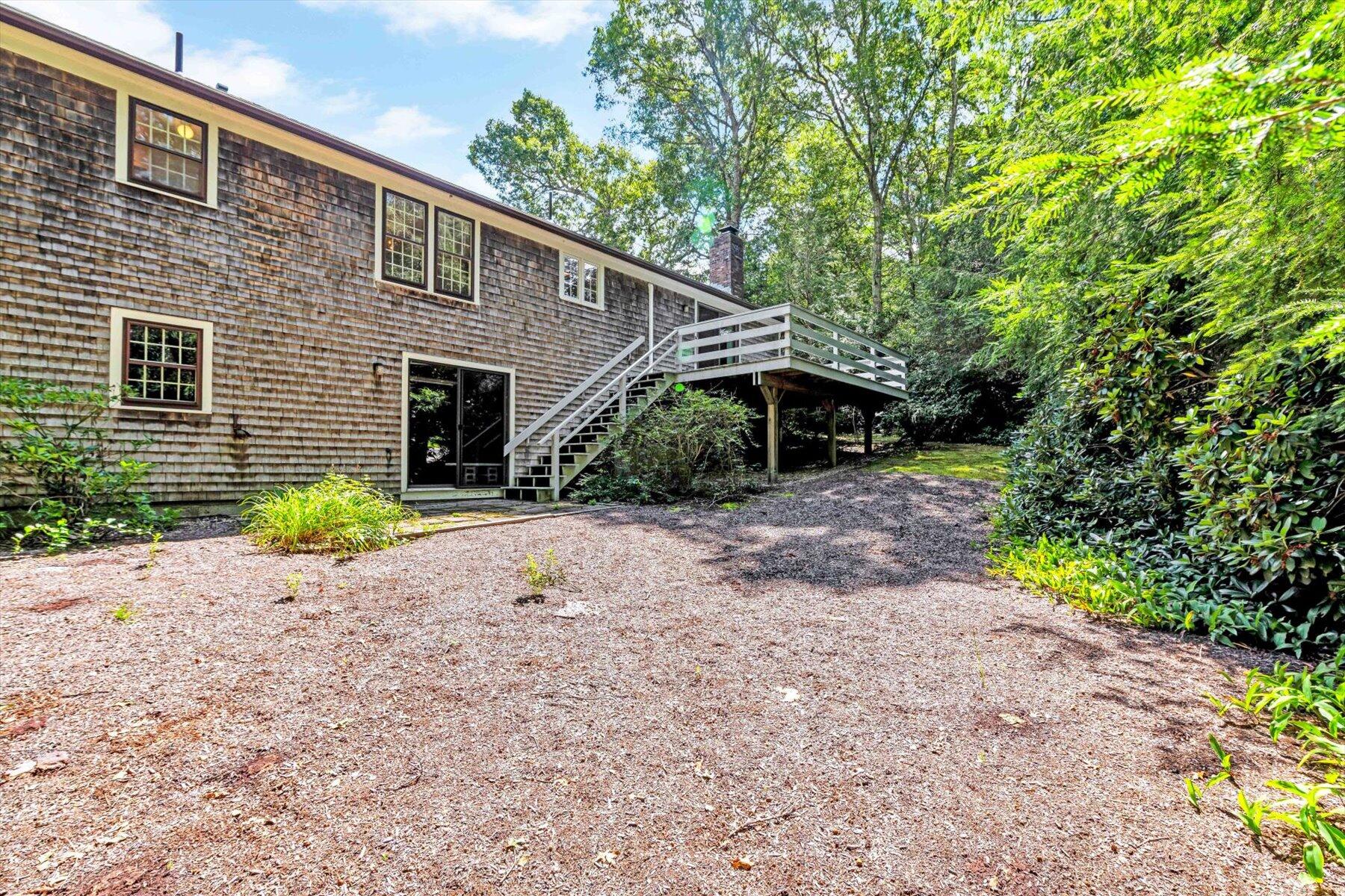 97 Headwaters Road Centerville, MA 02632 - Photo 39 of 44 a view of a house with a backyard