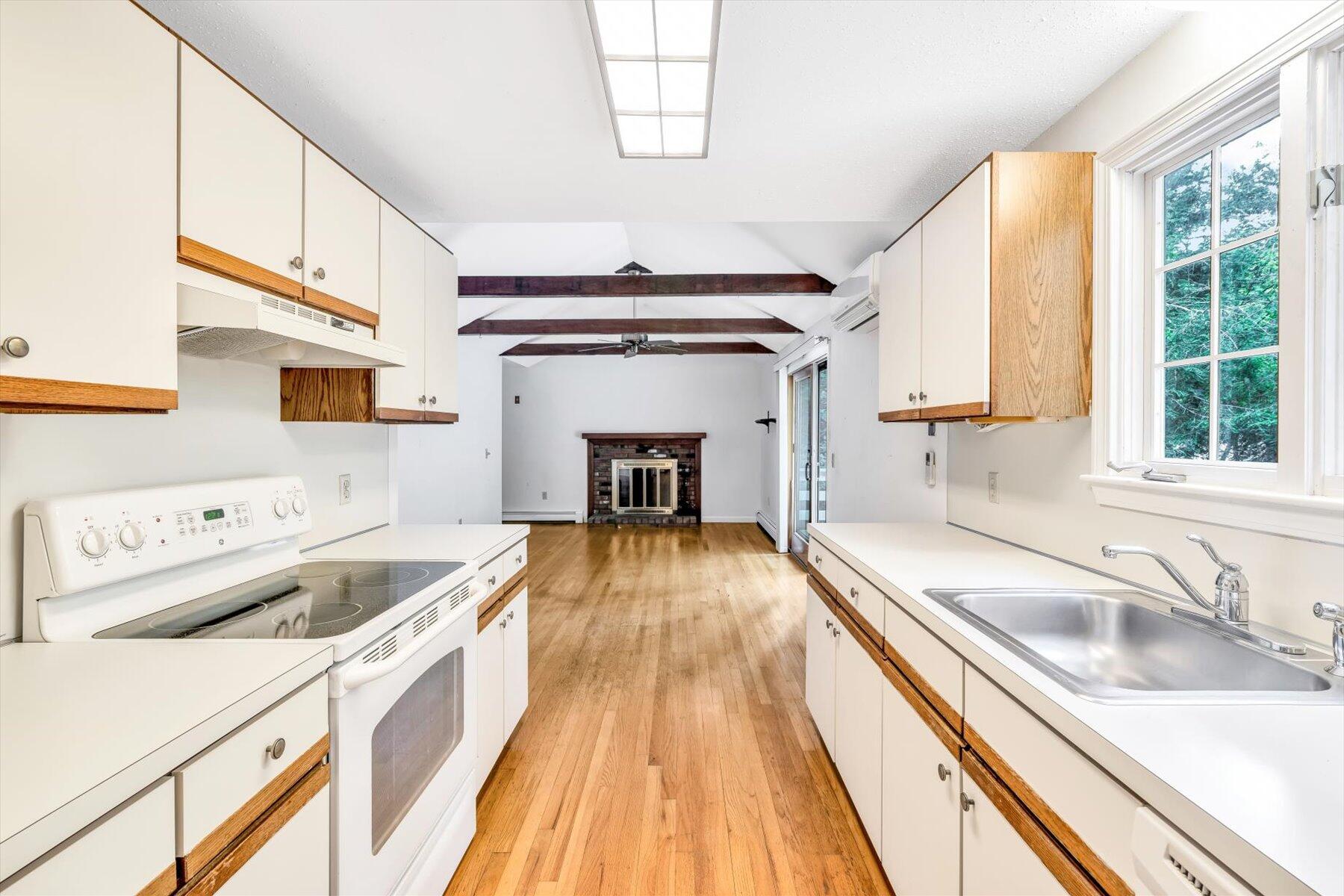 97 Headwaters Road Centerville, MA 02632 - Photo 10 of 44 a kitchen with a sink a stove and cabinets