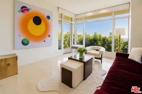 a living room with a couch and a large window