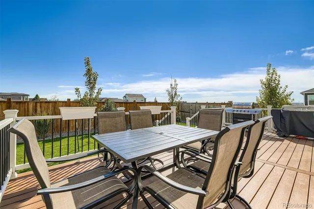 a view of a roof deck with patio