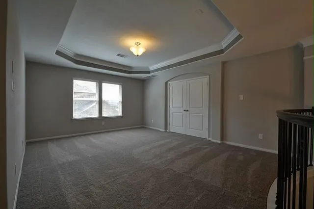 a view of an empty room and a window