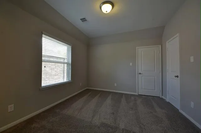 wooden floor and window in an empty room