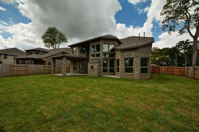 front view of a house with a garden