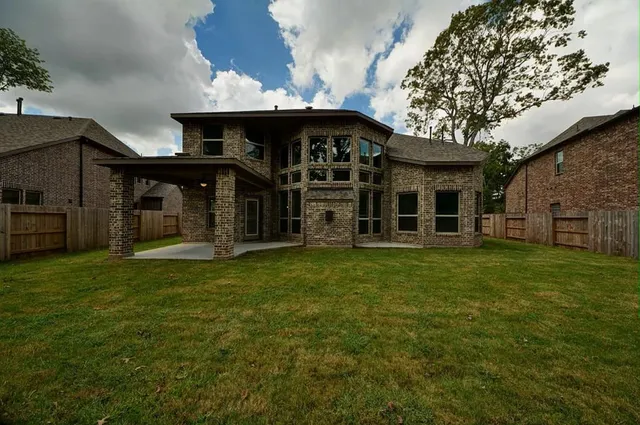 a view of a house with a garden