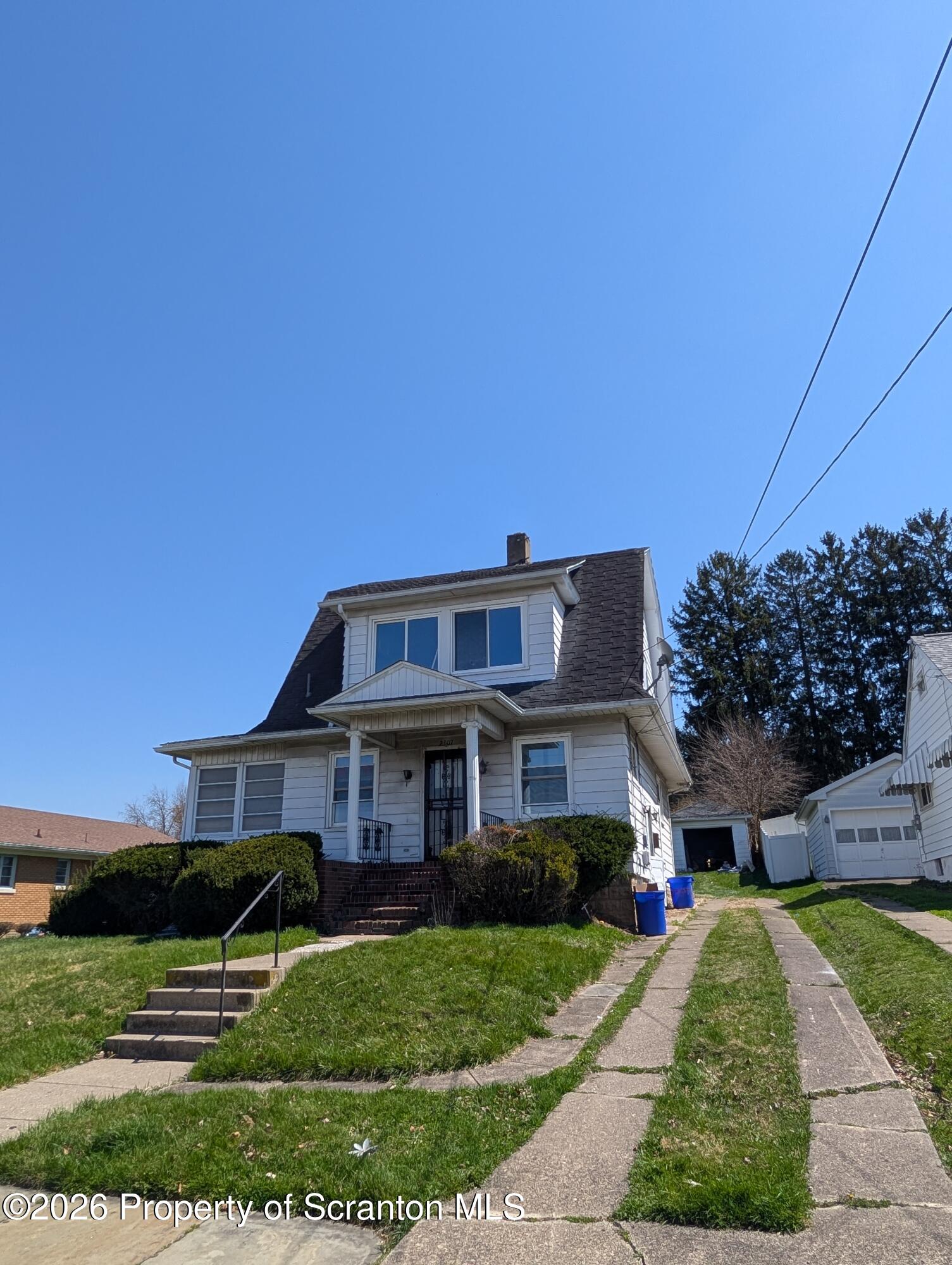 2307 Prospect Avenue Scranton, PA 18505 - Photo 1 of 11 a front view of a house with a yard