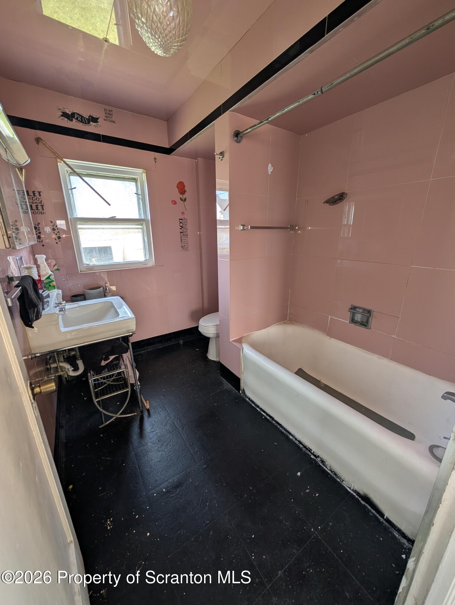 2307 Prospect Avenue Scranton, PA 18505 - Photo 9 of 11 a bathroom with a bathtub and a sink