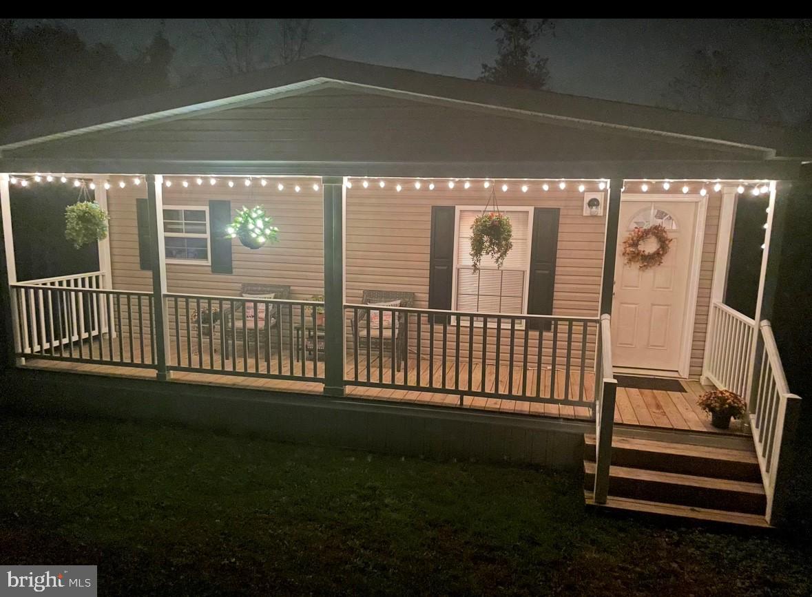 22 Apache Run Barto, PA 19504 - Photo 2 of 22 a view of a porch with a floor to ceiling window and stairs