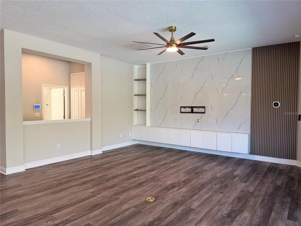 7004 Mainland Avenue Apollo Beach, FL 33572 - Photo 24 of 67 wooden floor in an empty room with a window