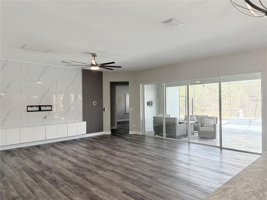 7004 Mainland Avenue Apollo Beach, FL 33572 - Photo 26 of 67 wooden floor in an empty room with a window