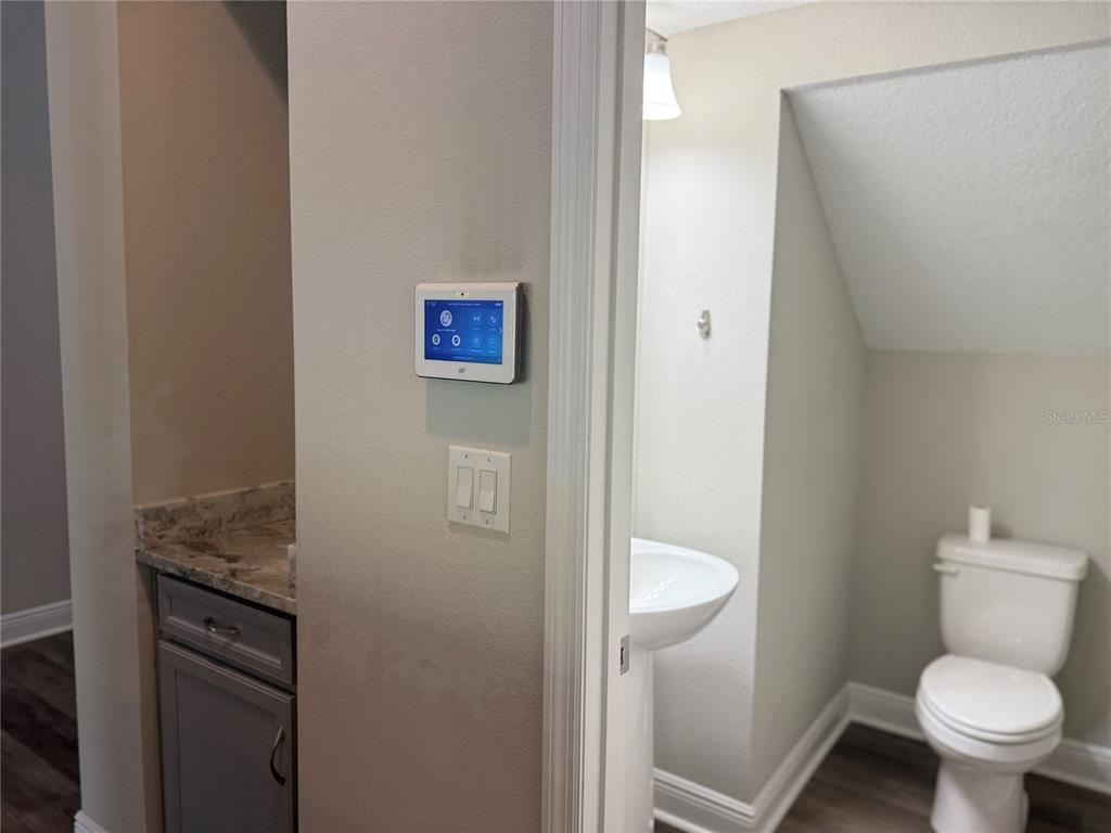 7004 Mainland Avenue Apollo Beach, FL 33572 - Photo 30 of 67 a bathroom with a toilet and a sink
