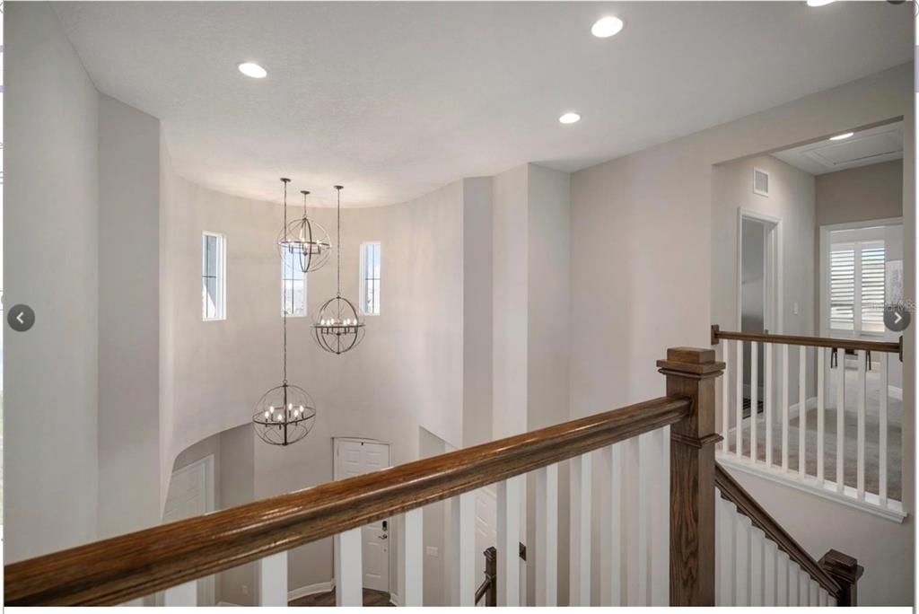 7004 Mainland Avenue Apollo Beach, FL 33572 - Photo 40 of 67 a view of a hallway with front door