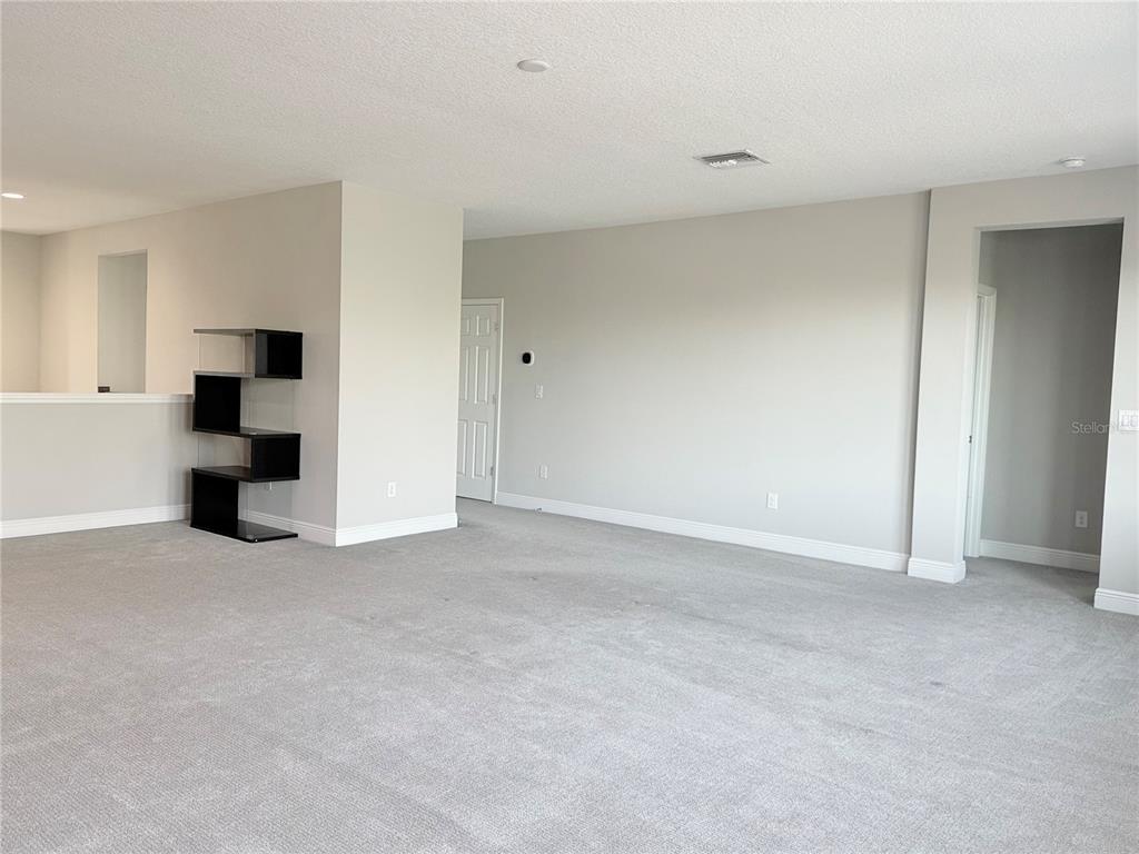 7004 Mainland Avenue Apollo Beach, FL 33572 - Photo 44 of 67 a view of an empty room with a cabinet