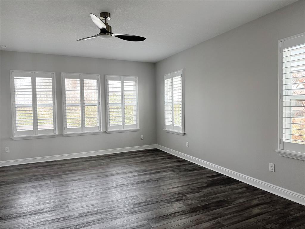 7004 Mainland Avenue Apollo Beach, FL 33572 - Photo 46 of 67 a view of empty room with wooden floor and fan