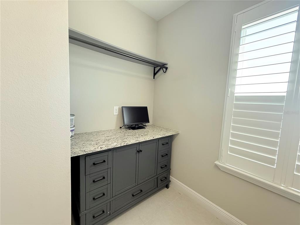 7004 Mainland Avenue Apollo Beach, FL 33572 - Photo 52 of 67 a kitchen with a granite countertop sink and a window