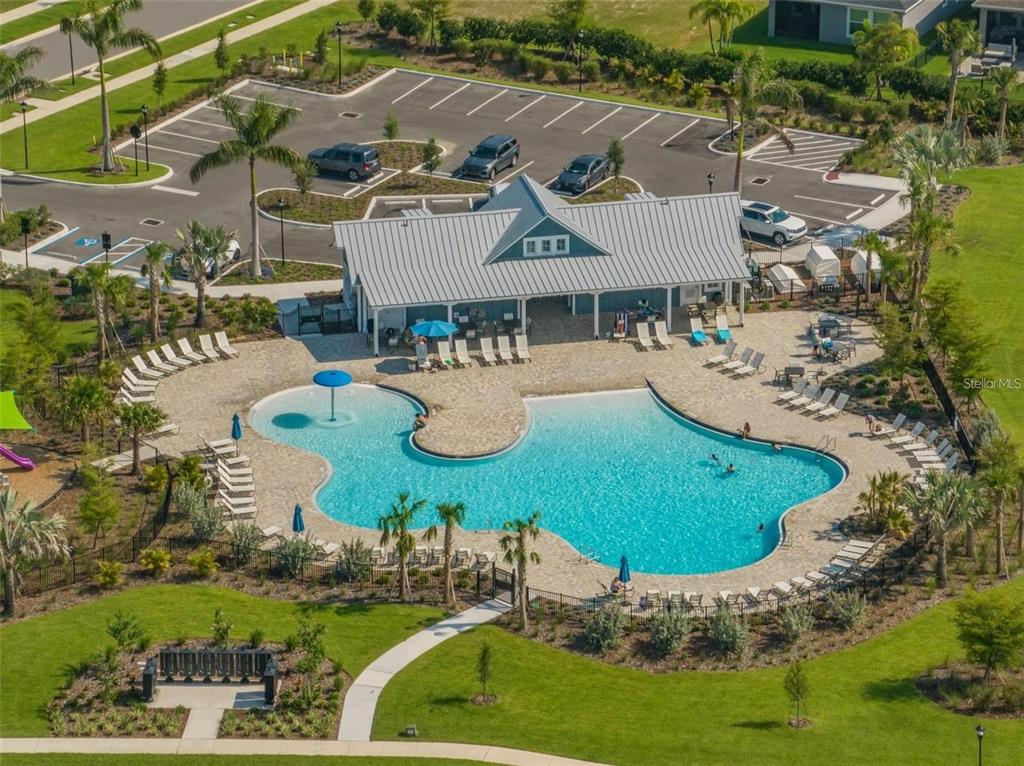 7004 Mainland Avenue Apollo Beach, FL 33572 - Photo 62 of 67 an aerial view of a house with outdoor space pool patio and lake view