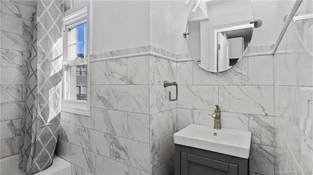 a bathroom with a sink and mirror