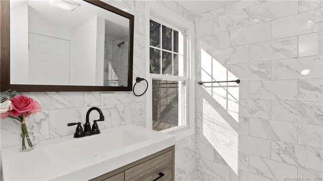 a bathroom with a sink and a mirror