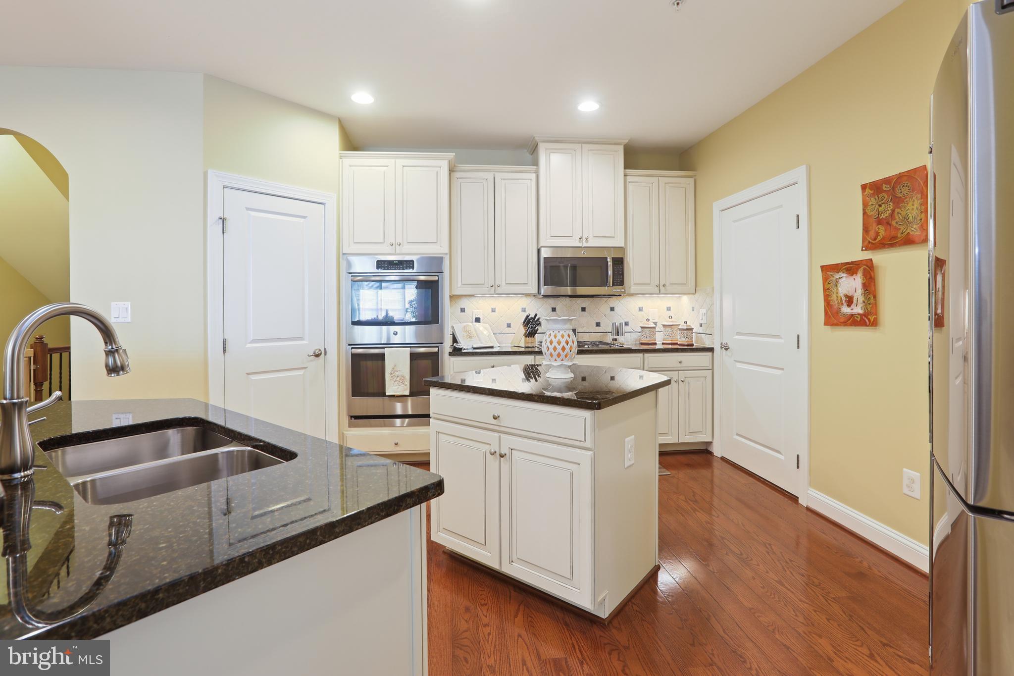 1843 Exton Drive, Unit 197 Fallston, MD 21047 - Photo 12 of 68 a kitchen with stainless steel appliances granite countertop a sink stove and refrigerator