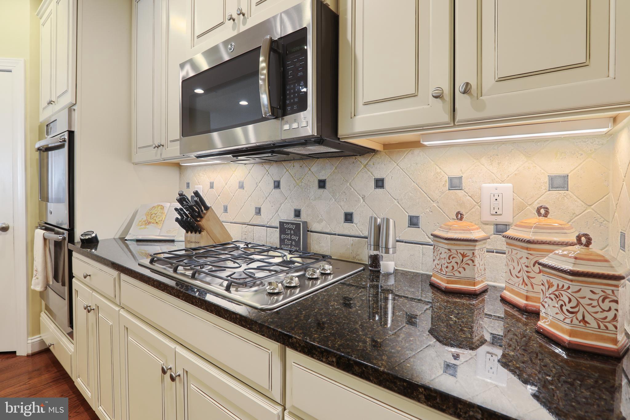 1843 Exton Drive, Unit 197 Fallston, MD 21047 - Photo 15 of 68 a kitchen with stainless steel appliances granite countertop a sink stove and cabinets