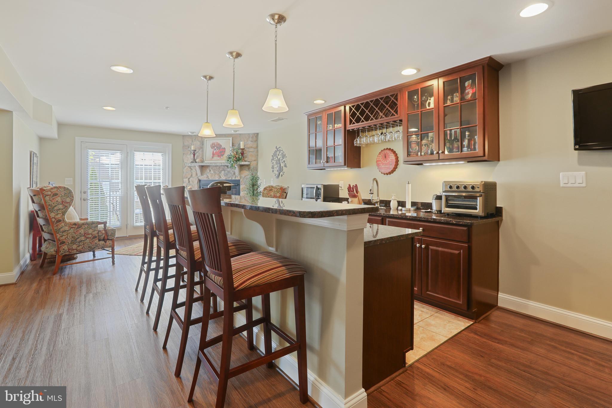 1843 Exton Drive, Unit 197 Fallston, MD 21047 - Photo 47 of 68 a kitchen with stainless steel appliances kitchen island granite countertop a sink and cabinets