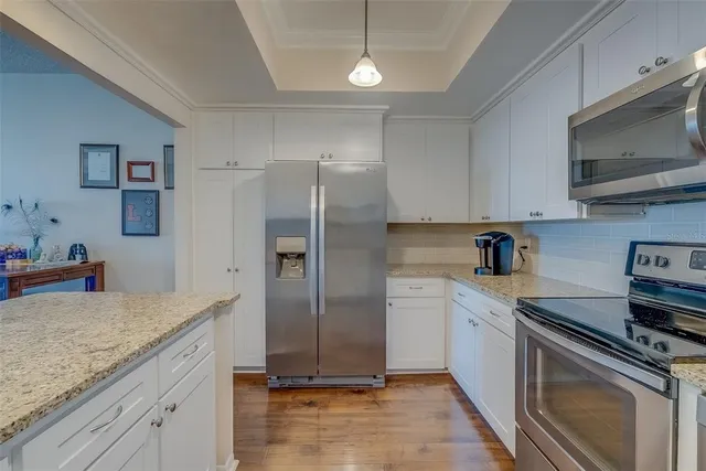 a view of living room with granite countertop furniture and fireplace