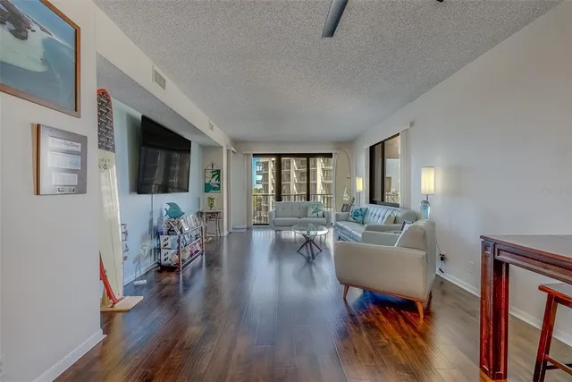 a living room with furniture fireplace and a flat screen tv
