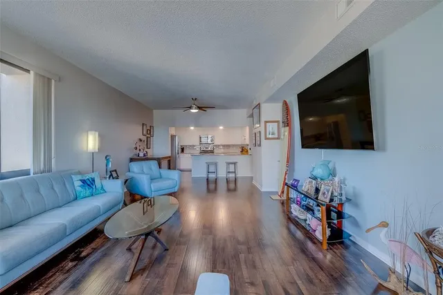 a bedroom with a bed and flat screen tv