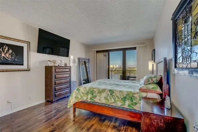 a bed room with a bed and a television